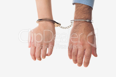 Hands of business people in handcuffs