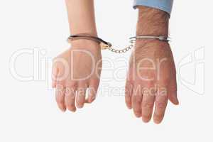 Hands of business people in handcuffs