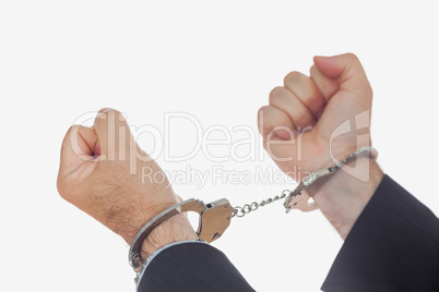 Man in handcuffs clenching fists