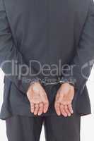Rear view of businessman with handcuffs