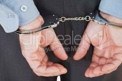Close-up of arrested businessman