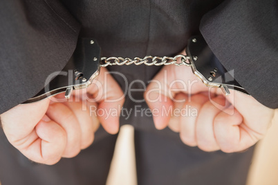 Attrested businessman clenching fists