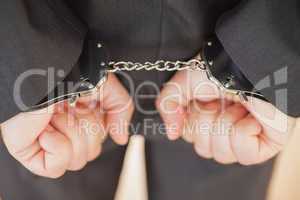 Attrested businessman clenching fists