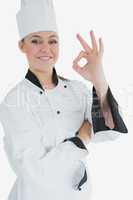 Happy female chef gesturing ok sign