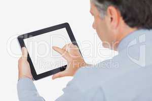 Mature businessman using digital tablet