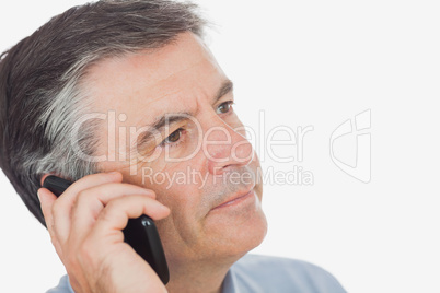 Businessman on call while looking away