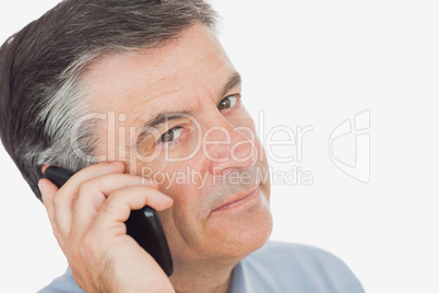 Mature businessman using mobile phone