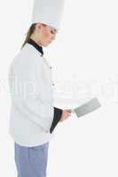Side view of chef holding meat cleaver