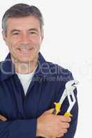 Mechanic with arms crossed holding  pliers