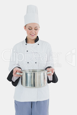 Happy chef holding utensil