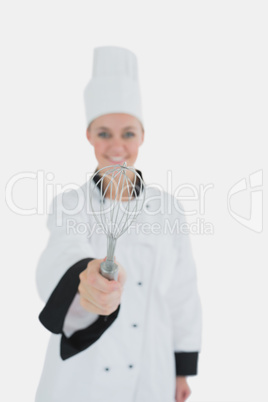 Portrait of chef holding wire whisk