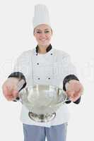 Female chef offering colander