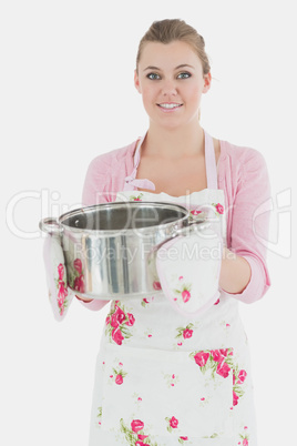 Portrait of young maid with cooking utensil