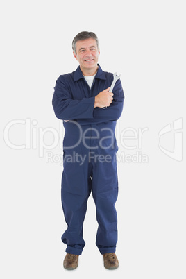 Portrait of mature mechanic with wrench