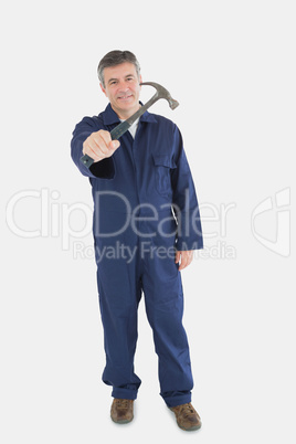 Male technician holding hammer