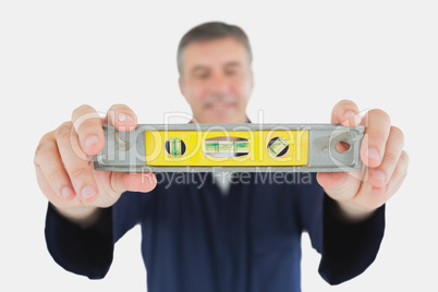 Technician holding spirit level