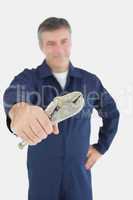 Male mechanic holding vise grip