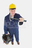Mechanic with hammer carrying tool bag