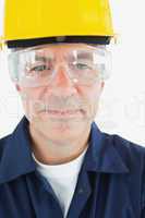 Confident technician wearing protetive glasses and hardhat