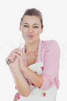 Maid using wire whisk as microphone while signing