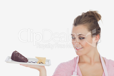 Young woman looking at pastry