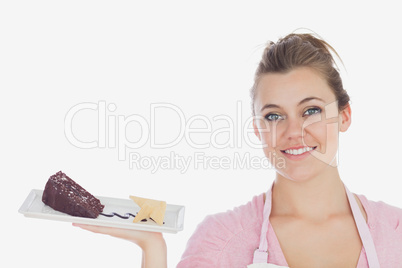 Happy young woman with plate of pastry