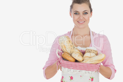 Maid holding basket full of breads