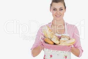 Maid holding basket full of breads