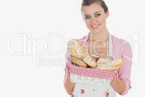 Beautiful woman holding bread basket