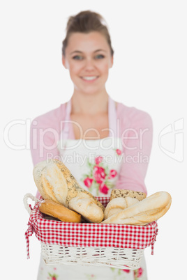 Happy young woman with bread basket