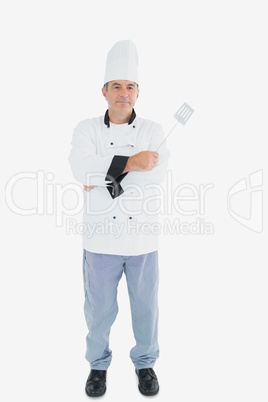 Male chef holding spatula