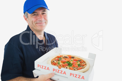 Happy delivery man holding pizza