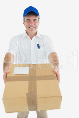 Happy delivery man giving package