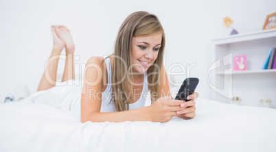 Blonde woman looking at her phone