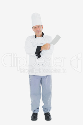 Confident chef with meat cleaver