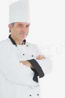 Male chef in uniform with arms crossed