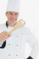 Happy chef holding out spatula