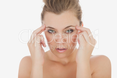 Woman massaging her temples