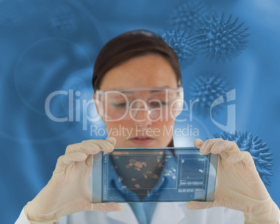 Nurse wearing glasses and holding a virtual screen