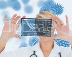 Blonde nurse holding a virtual screen