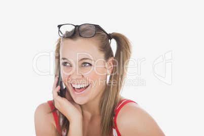 Cheerful young woman using cell phone