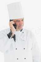 Male chef using cell phone