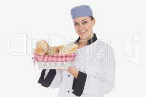 Woman in chef uniform with bread basket