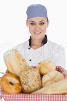 Female chef with variety of breads