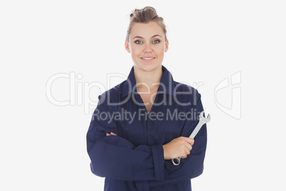 Female mechanic holding spanner