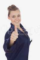 Female technician gesturing thumbs up