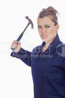 An angry female mechanic holding claw hammer
