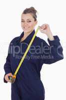 Female mechanic with measuring tape