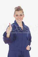 Female technician witth hand on waist showing thumbs up sign