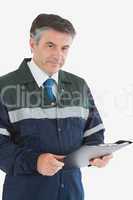 Mature repairman holding clipboard